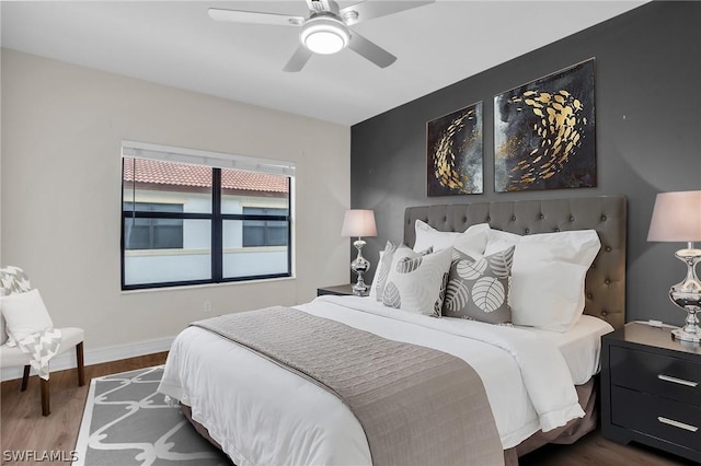 bedroom featuring hardwood / wood-style flooring and ceiling fan