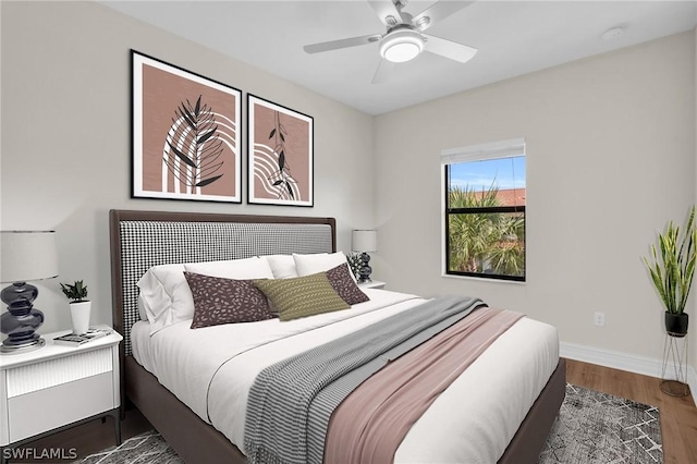 bedroom featuring dark hardwood / wood-style floors and ceiling fan