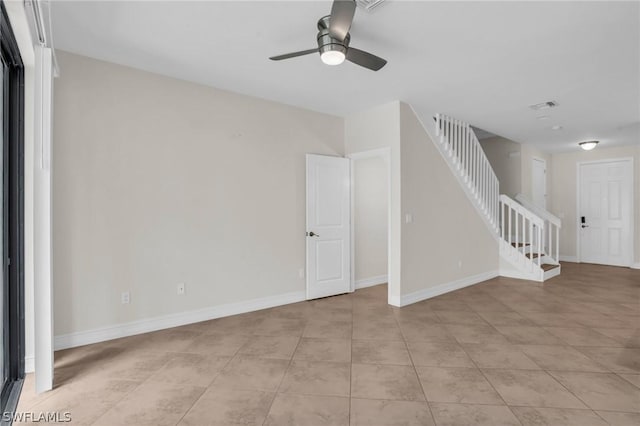 unfurnished living room with light tile patterned floors and ceiling fan