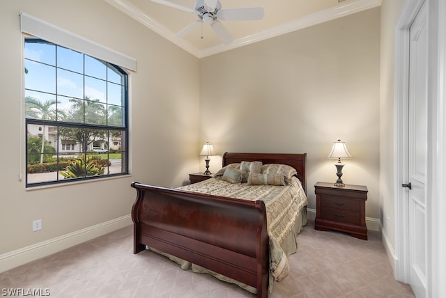 bedroom with ceiling fan and crown molding