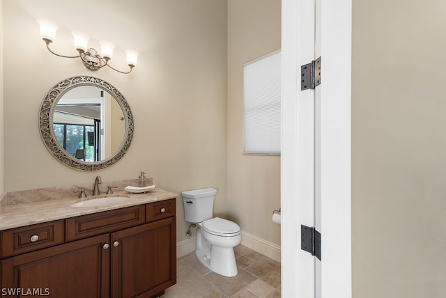 bathroom with toilet and vanity