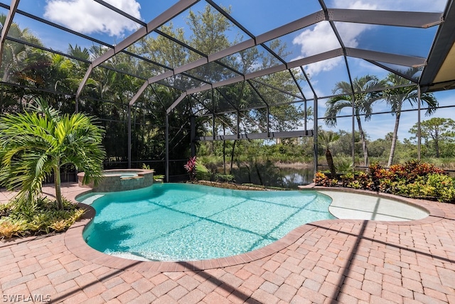 view of swimming pool with an in ground hot tub, a water view, a lanai, and a patio area