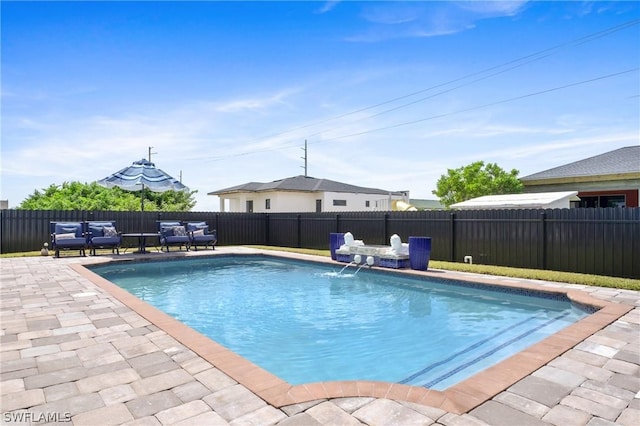 view of swimming pool with a fenced in pool, a patio area, and a fenced backyard