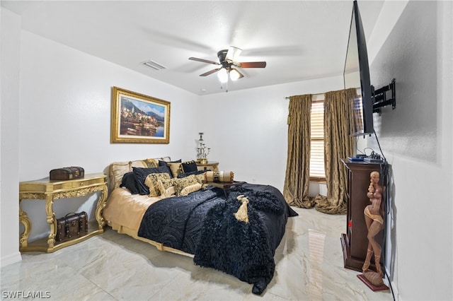 tiled bedroom featuring ceiling fan