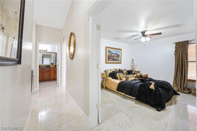 bedroom with visible vents, a ceiling fan, baseboards, marble finish floor, and ensuite bath