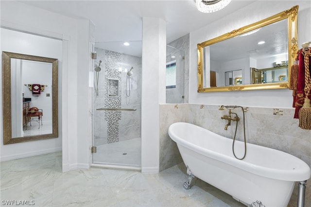 bathroom featuring shower with separate bathtub, tile patterned flooring, and tile walls