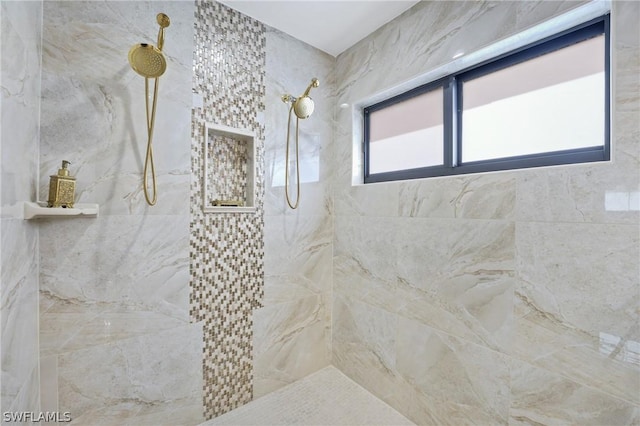 bathroom with tiled shower