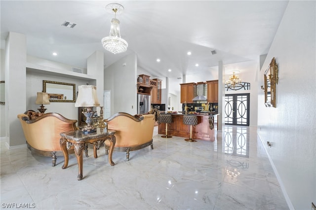 tiled living room featuring vaulted ceiling and a notable chandelier