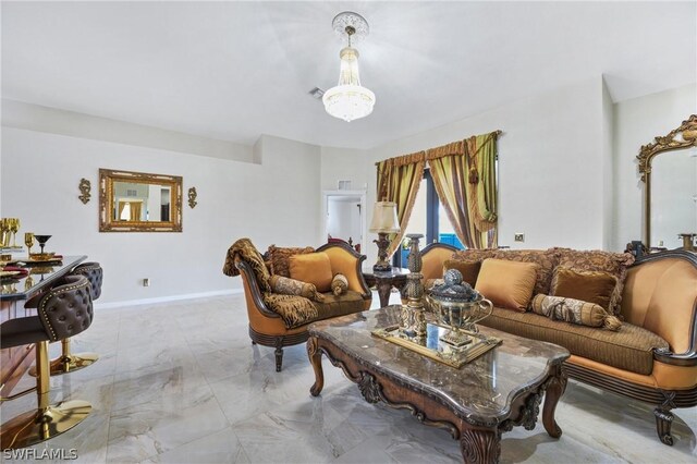 living room with marble finish floor, visible vents, and baseboards