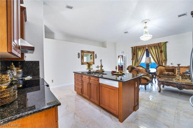 kitchen featuring dark stone counters, sink, pendant lighting, light tile patterned flooring, and ventilation hood