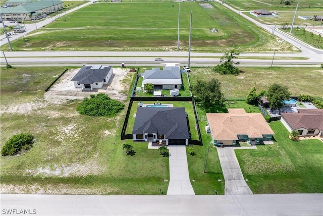 birds eye view of property with a residential view