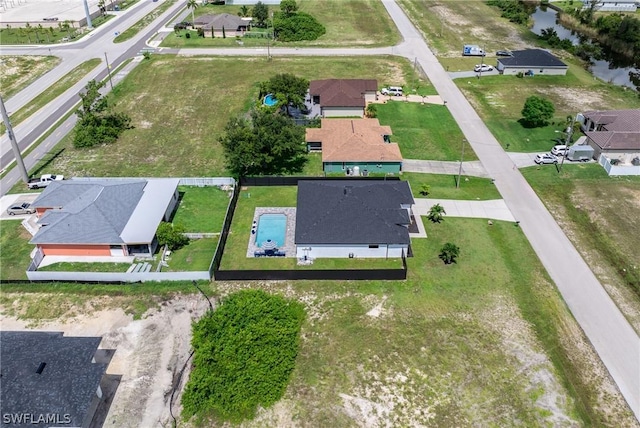 birds eye view of property with a residential view