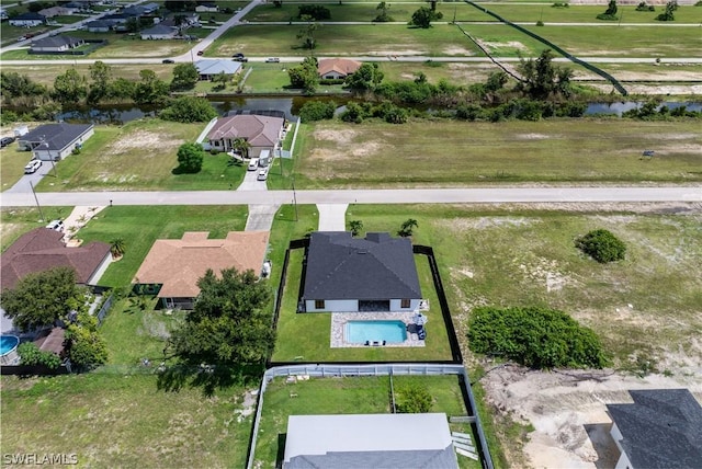 aerial view featuring a water view and a residential view