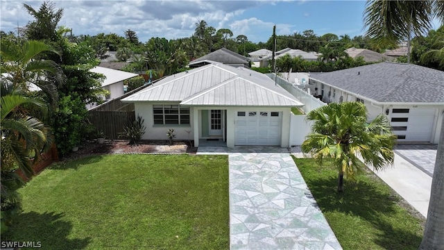 view of front of home featuring a garage and a front yard