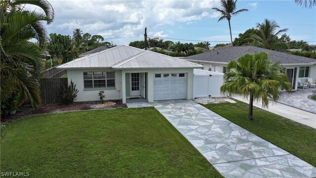 ranch-style home with a garage and a front yard