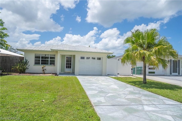 ranch-style home featuring a garage and a front lawn