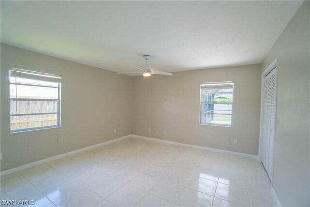 spare room with ceiling fan