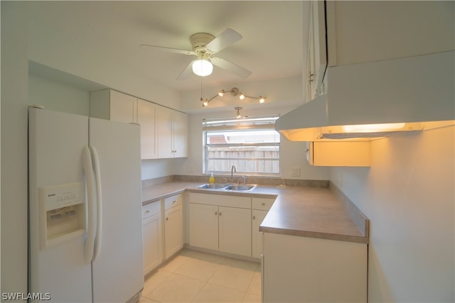 kitchen with white cabinetry, light tile patterned floors, sink, and white fridge with ice dispenser