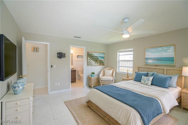 tiled bedroom with ceiling fan and connected bathroom