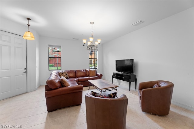 tiled living room with a chandelier