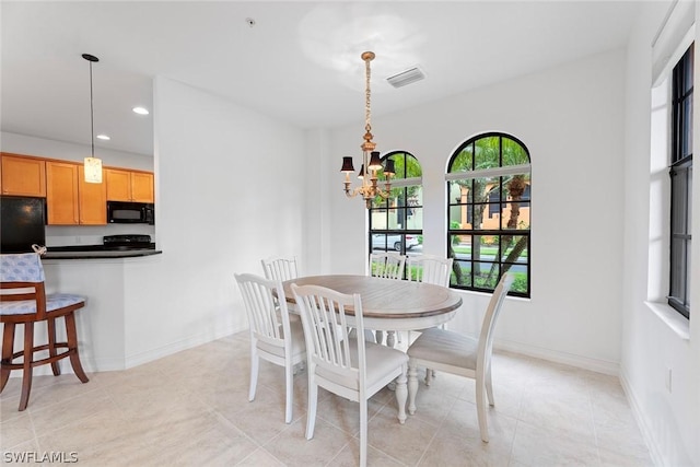 dining space featuring light tile patterned floors, recessed lighting, a notable chandelier, visible vents, and baseboards