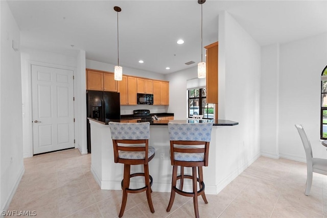 kitchen with dark countertops, recessed lighting, hanging light fixtures, a peninsula, and black appliances