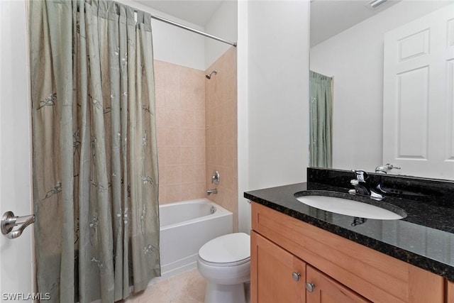 bathroom with vanity, shower / bath combo with shower curtain, toilet, and tile patterned floors