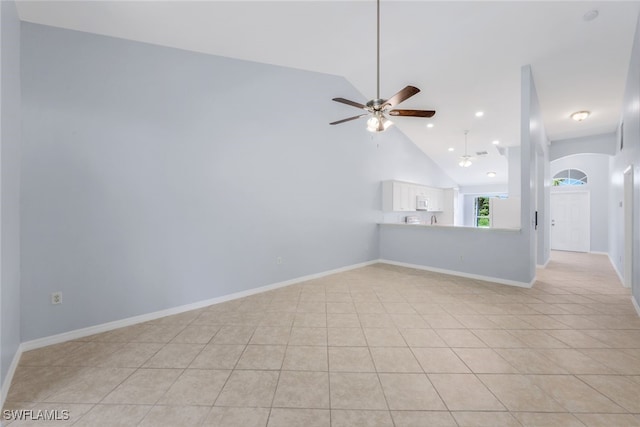 interior space with ceiling fan and high vaulted ceiling