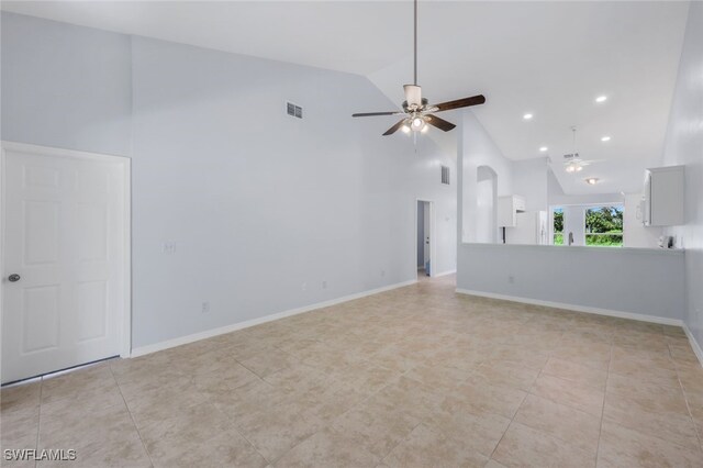 unfurnished living room with ceiling fan, high vaulted ceiling, and light tile patterned flooring