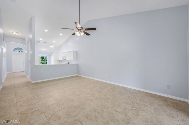 unfurnished living room featuring ceiling fan, high vaulted ceiling, and light tile patterned flooring