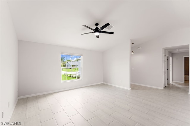 spare room with ceiling fan and lofted ceiling