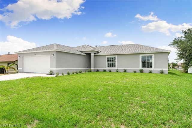 view of front of property with a front lawn and a garage