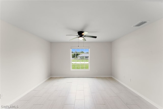 unfurnished room with ceiling fan