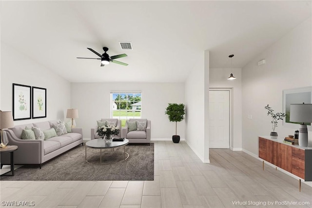 living room with ceiling fan and lofted ceiling