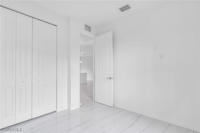 unfurnished bedroom with a closet