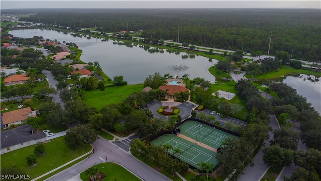 birds eye view of property with a water view