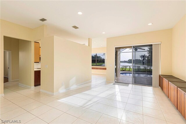 spare room with light tile patterned floors