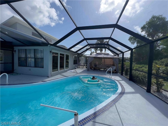 view of pool featuring a patio area and a lanai