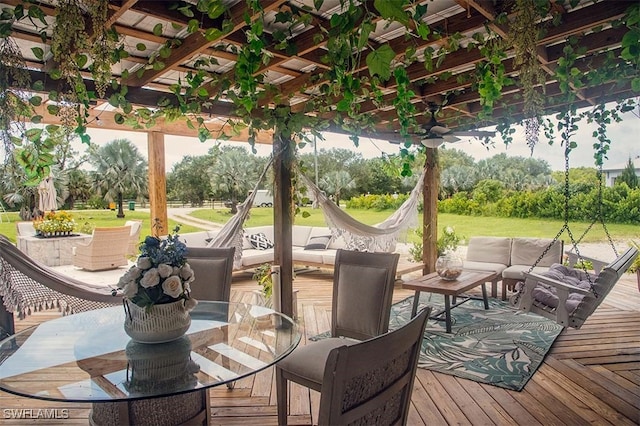 deck with a yard and outdoor lounge area