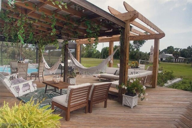 wooden deck featuring outdoor lounge area, a pergola, and a lawn