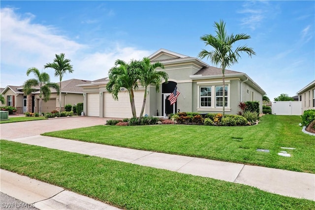 ranch-style house with a garage and a front yard