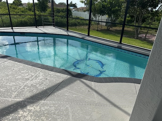 view of swimming pool with a patio