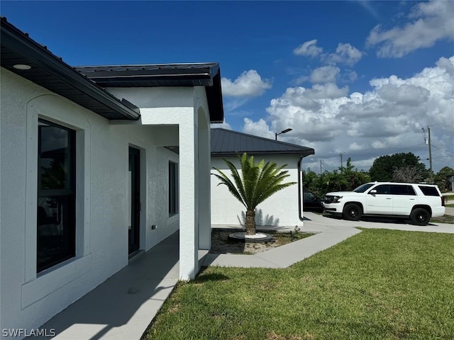 view of home's exterior featuring a yard