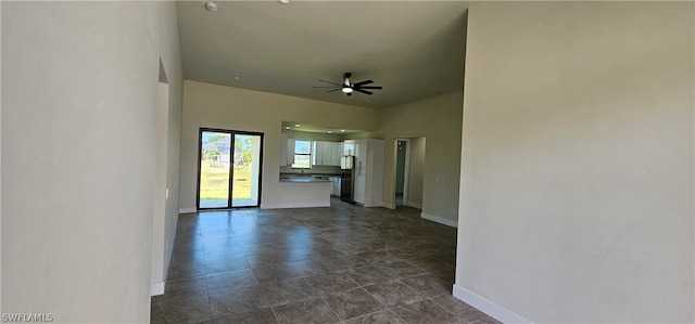 unfurnished room with tile patterned flooring and ceiling fan