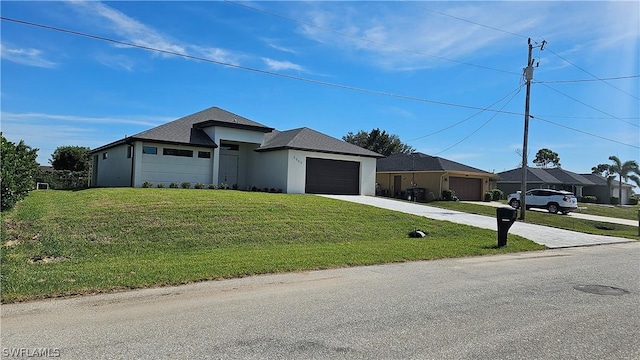 view of front facade with a front yard and a garage