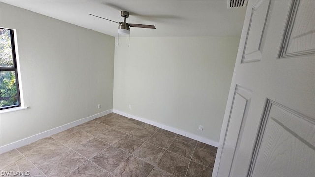 unfurnished room with ceiling fan and a healthy amount of sunlight