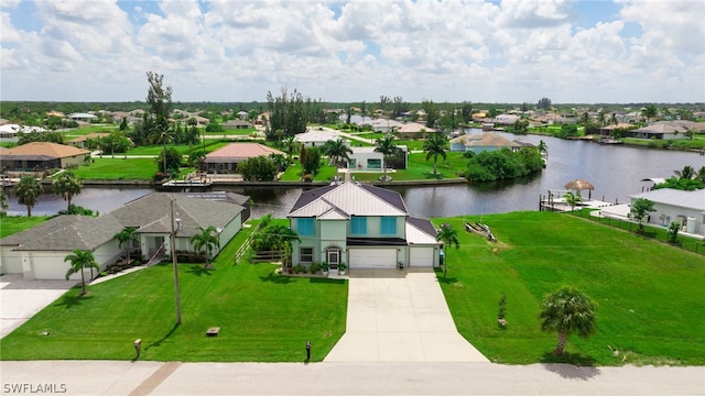 birds eye view of property featuring a water view