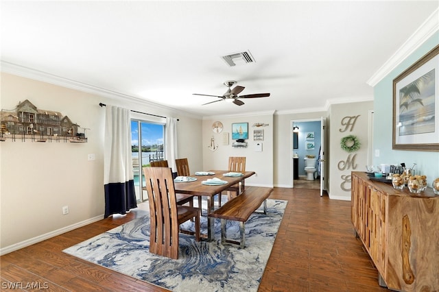 dining space with dark hardwood / wood-style flooring, crown molding, and ceiling fan