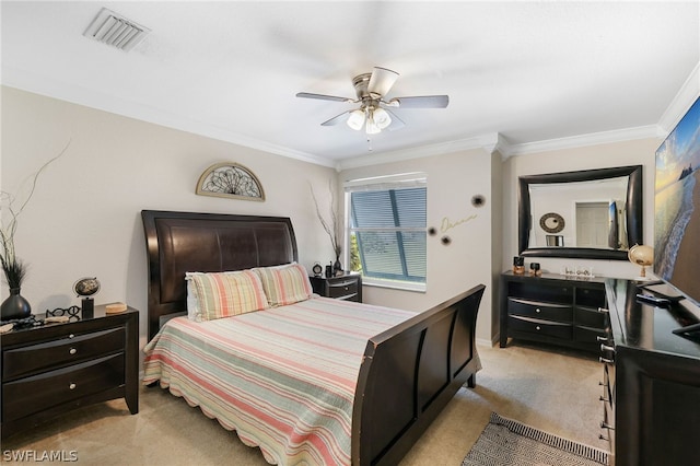 carpeted bedroom featuring ceiling fan and ornamental molding