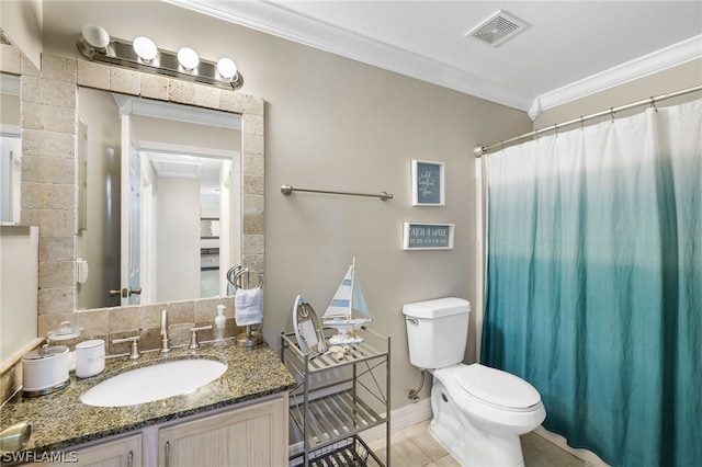 bathroom featuring tile patterned floors, ornamental molding, toilet, and vanity